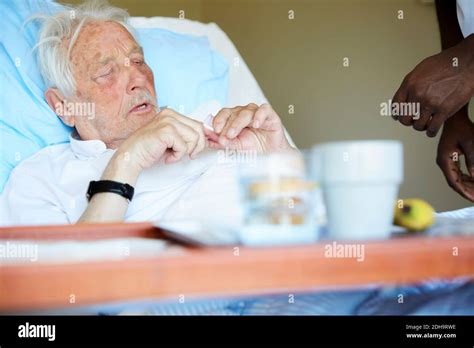 senior man  medicine  hospital bed stock photo alamy