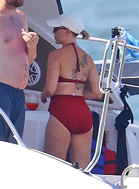 Scarlett Johansson shows off tattoos in red bikini in Hamptons