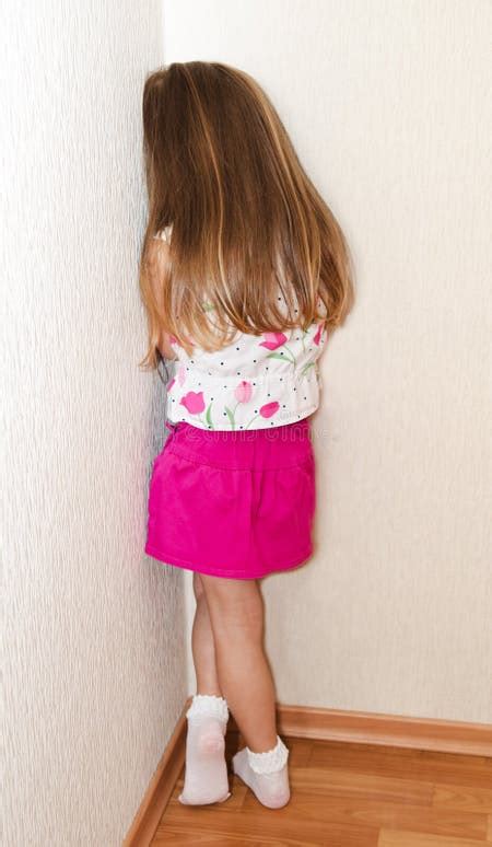 Naughty Little Girl is Standing in the Corner Stock Photo - Image of