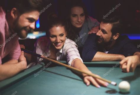 Friends playing pool game — Stock Photo © gpointstudio #106172682