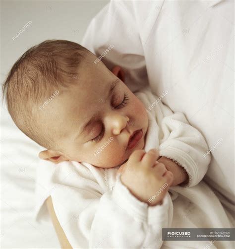 Babies Sleeping In Parents Arms