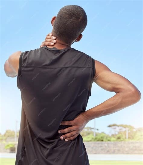 Premium Photo | Injured athlete with sore neck and back muscles from