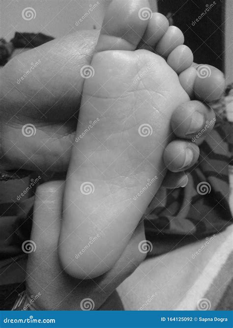 Abstract of Close Up View of Flatside of Baby`foot Holded by His Mother