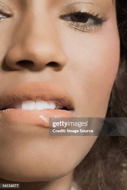 bitten lip   premium high res pictures getty images