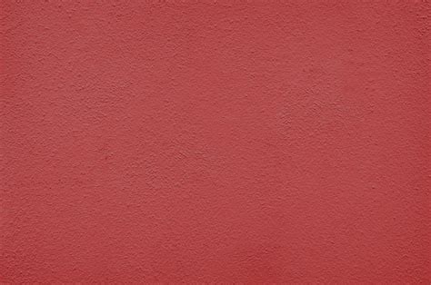 Premium Photo | Red wall texture background with paint droplets