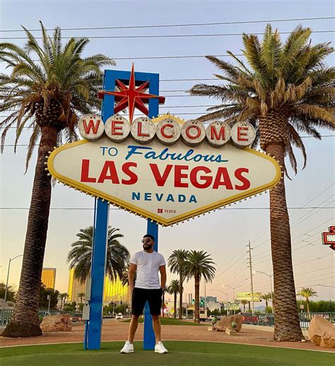 Download Amir Albazi With Las Vegas Sign Wallpaper | Wallpapers.com