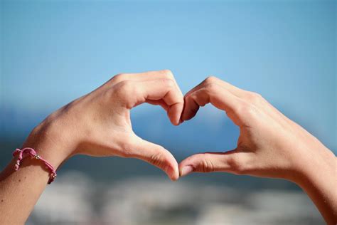 person  heart hand sign  stock photo