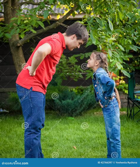 Angry Father and Daughter Looking at Each Other Stock Image - Image of