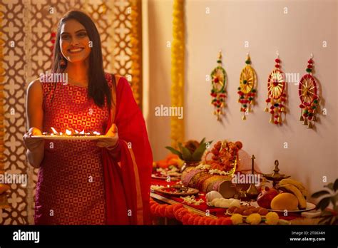 Woman worshipping (Goddess Laxmi, goddess of wealth ) on the during ...