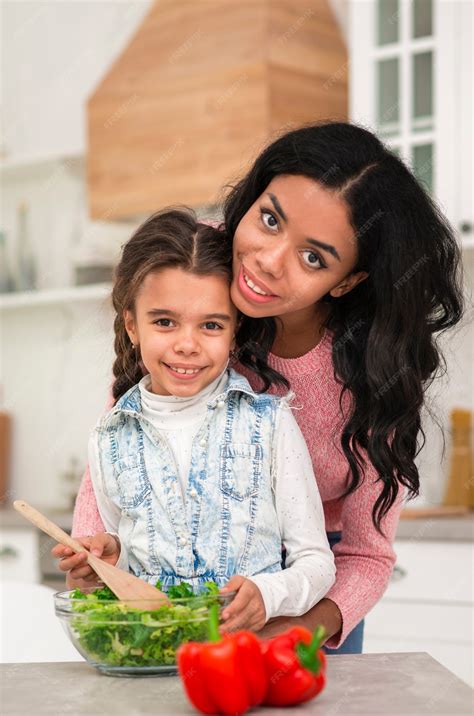 Free Photo | Mom teaching daughter to cook