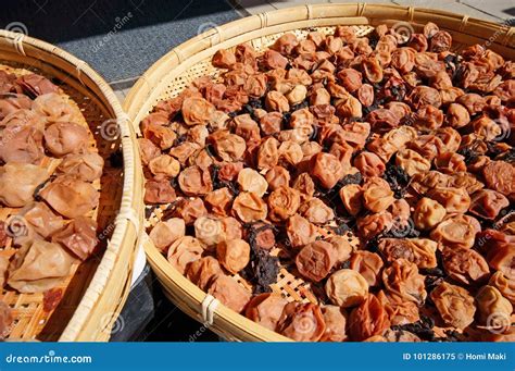 making umeboshijapanese salty pickled plums stock photography