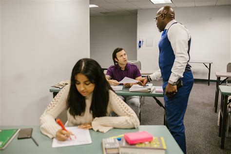 Teacher Caught His Student Cheating During an Exam · Free Stock Photo
