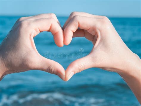 Heart from Hands on the Beach Stock Image - Image of male, exercise ...