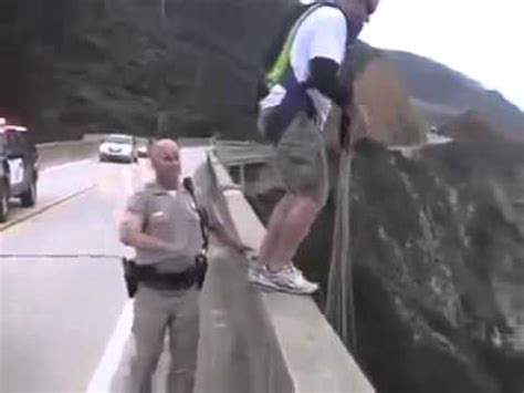 Guy Base Jumps off a bridge to get away from cop - YouTube