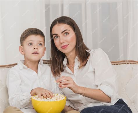 Free Photo | Mother and son watching a movie together