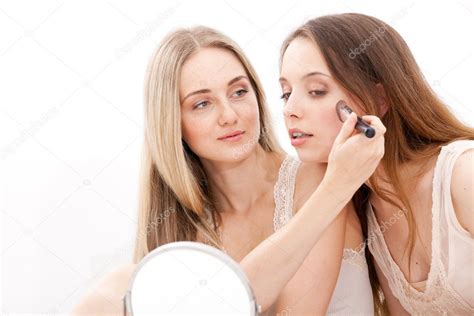 Group of women applying makeup on face Stock Photo by ©MarinaSvetlova ...