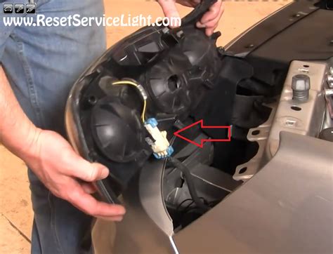 how to change a 2009 chevy malibu headlight