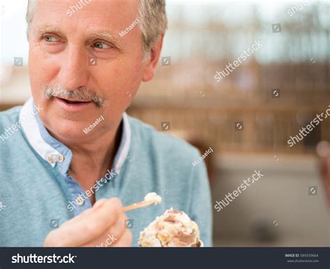 man eating ice cream stock photo  shutterstock