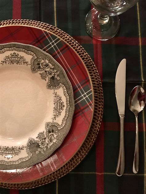 Festive Christmas Dinner Table Setup with Red Tartan and Black Toile Plates