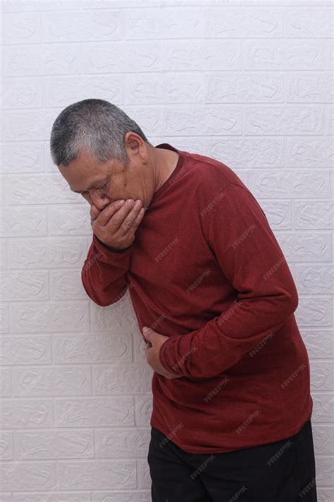 Premium Photo | Asian aged man eat spoiled lunch feel stomachache vomit