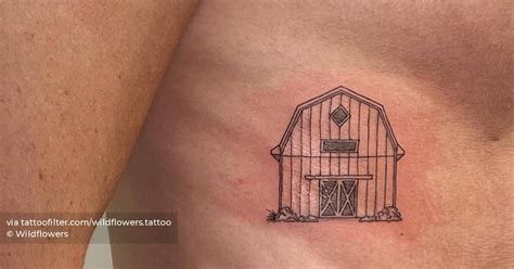 Small fine line barn tattoo located on the rib.