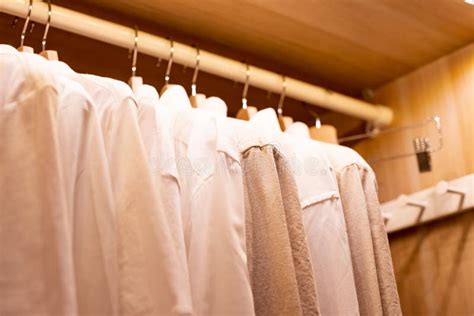 Hangers with Different Clothes in Wardrobe Closet.shirts and Dress ...