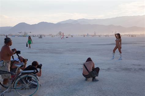 Posing for a crowd of random guys at Burning Man | Scrolller
