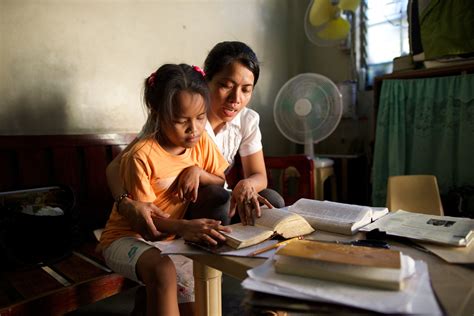 Mother and Daughter Study the Scriptures