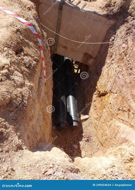 Construction Workers Risk Their Lives Working Inside Deep Trenches To