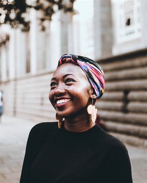 Download Empowered Black Woman with Vibrant Head Wrap Wallpaper