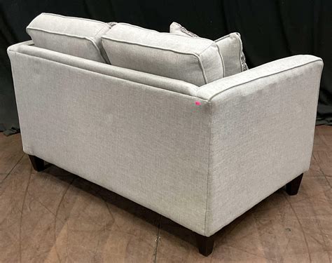Lot - Hughes Furniture Company Loveseat w/ Pillows