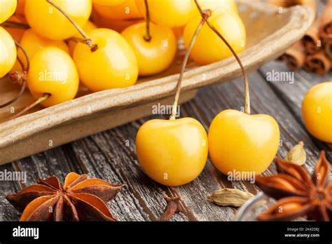 yellow cherry  wood background stock photo alamy