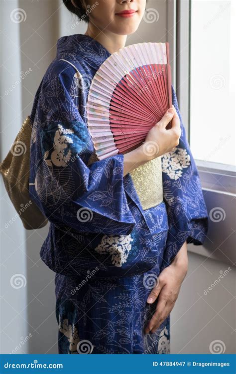 Geisha with a fan stock image. Image of costume, home - 47884947