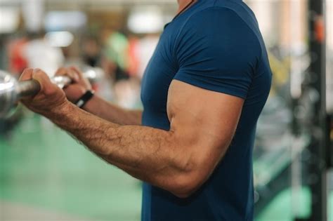 Premium Photo | Close up of young athlete trains in the gym trians ...