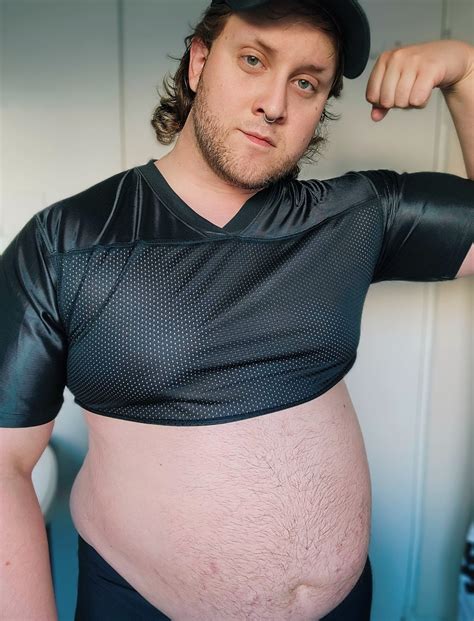 Growing Bellies, Shrinking Clothes — Filling out this jersey 🏈🐷