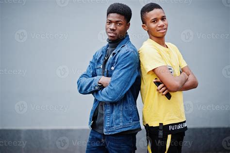 Two african male friends talking together. 10500896 Stock Photo at Vecteezy