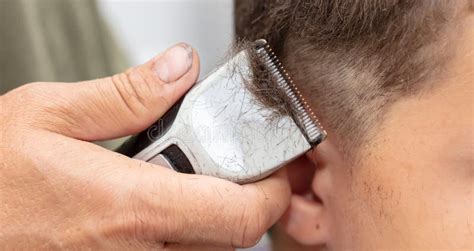 The Boy is Trimmed with a Trimmer Stock Photo - Image of salon, barber ...