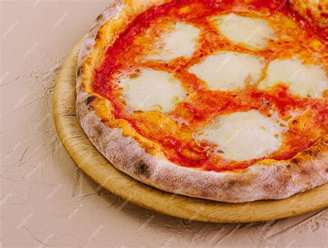Premium Photo | Traditional Neapolitan Pizza on wooden board