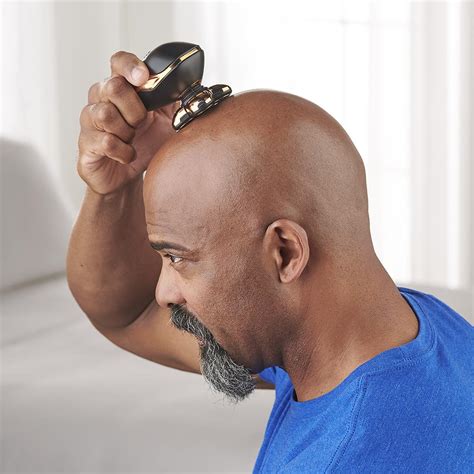 The Ergonomic Head Shaver - Hammacher Schlemmer