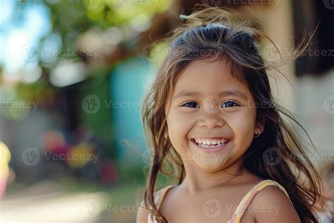 Pretty little latin girl smiling happily outside. 46178866 Stock Photo