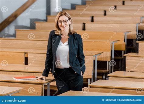 beautiful female university professor smiling    camera