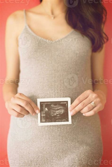 happy pregnant woman showing ultrasound picture 31048498 Stock Photo at ...