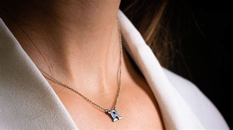 initial necklaces show  world     give