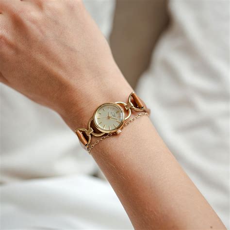 small  gold face womens  light brown leather strap