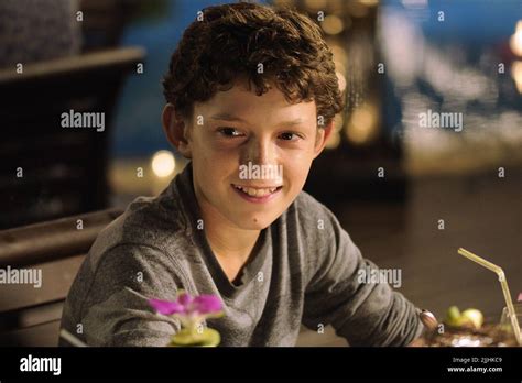 TOM HOLLAND, THE IMPOSSIBLE, 2012 Stock Photo - Alamy