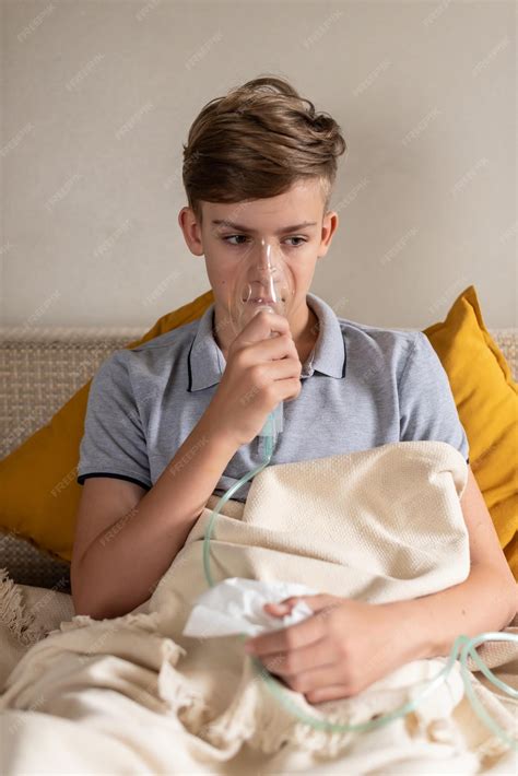 Premium Photo | Sick teen boy with an inhaler Unhealthy child doing