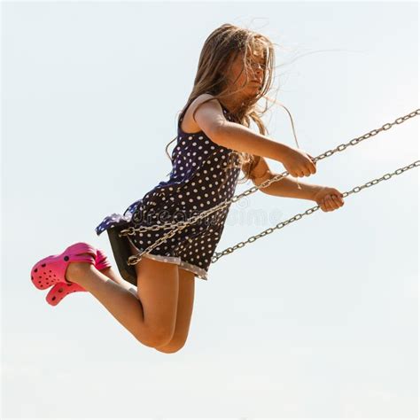 girl swinging  swing set stock image image  swinging moving