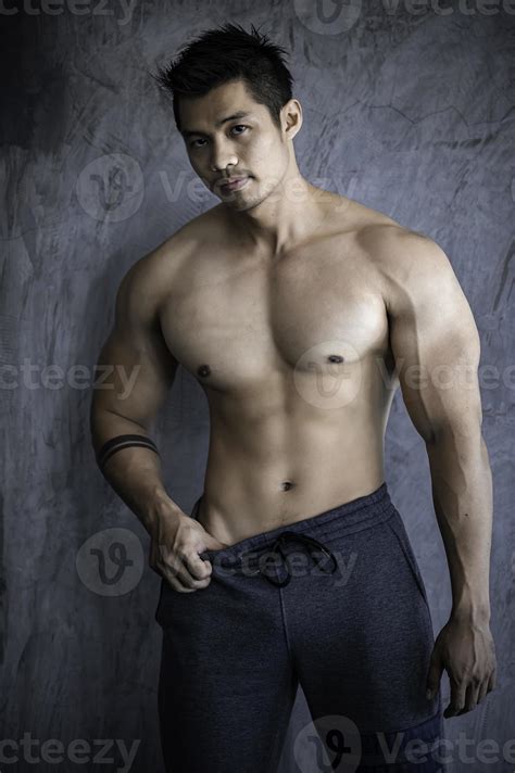 Portrait of asian man big muscle at the gym,Thailand people,Workout for