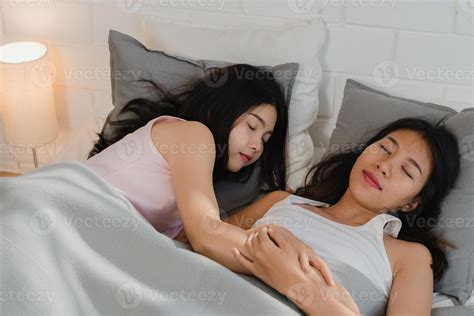 Asian Lesbian couple sleep together at home. Young Asian LGBTQ women