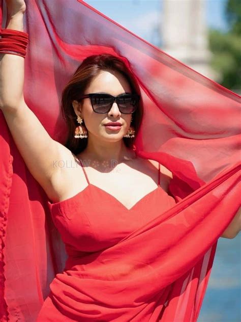 sexy neha malik   red saree  matching spaghetti strap sleeveless